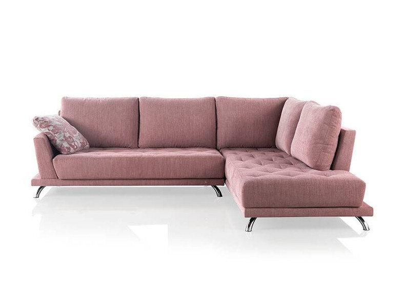 Sofá chaiselongue de color rosa para salón